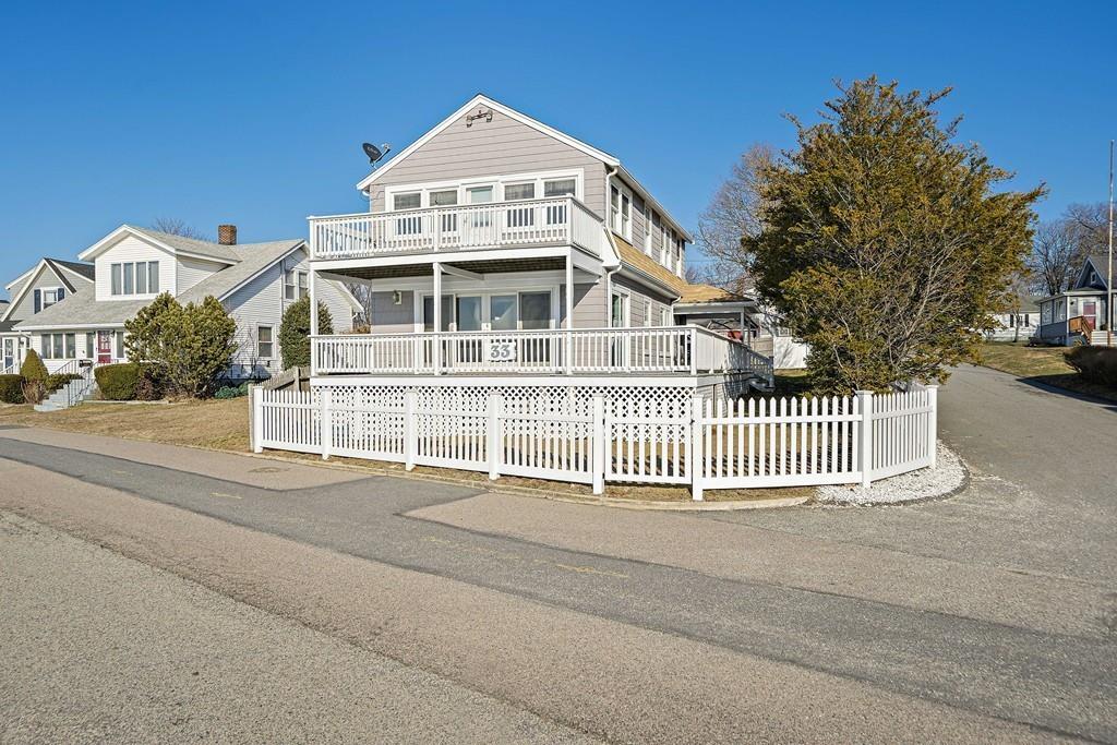 33 Fort Point Road Weymouth, MA 02191 - Photo 4 of 41 a front view of a house with a fence