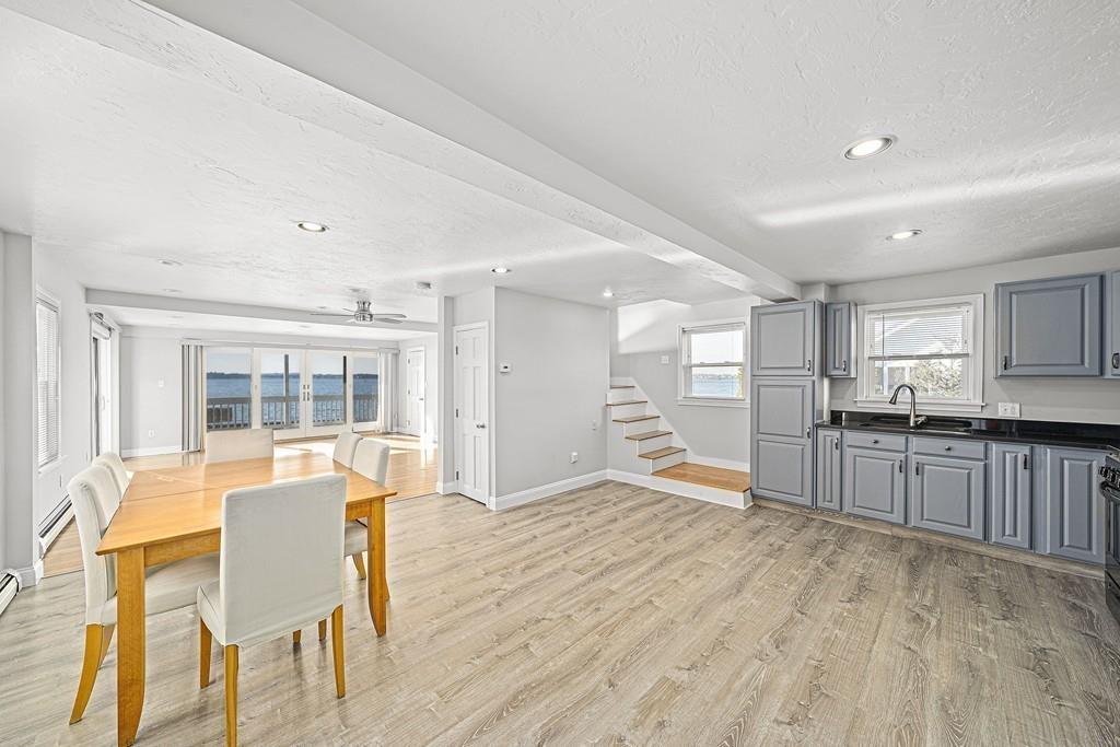 33 Fort Point Road Weymouth, MA 02191 - Photo 6 of 41 a view of a kitchen with furniture and wooden floor