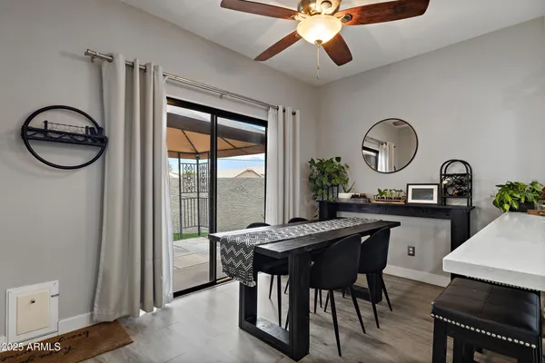 a living room with stainless steel appliances kitchen island granite countertop furniture and a view of kitchen