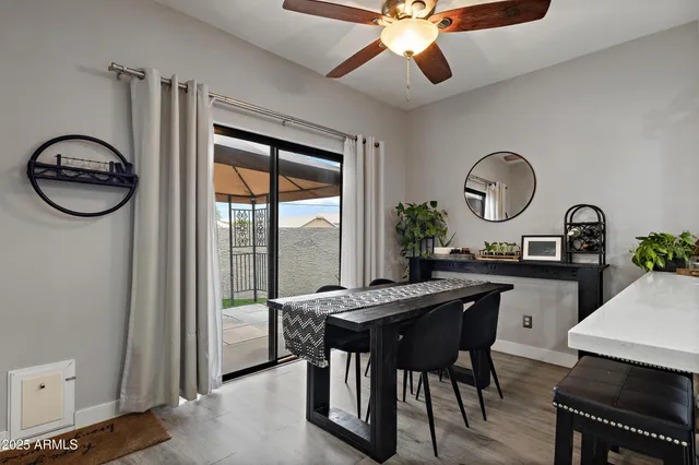 a living room with stainless steel appliances kitchen island granite countertop furniture and a view of kitchen