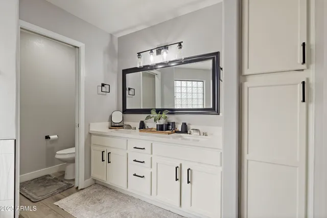 a bathroom with a sink and a mirror