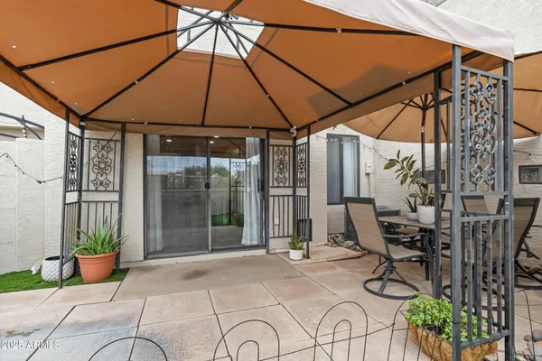 a view of yard with patio