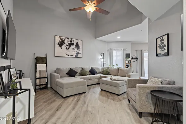 a living room with furniture and a flat screen tv