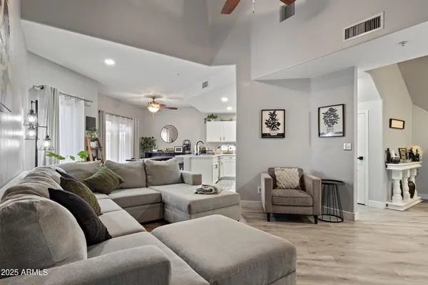 a kitchen with a refrigerator and a sink