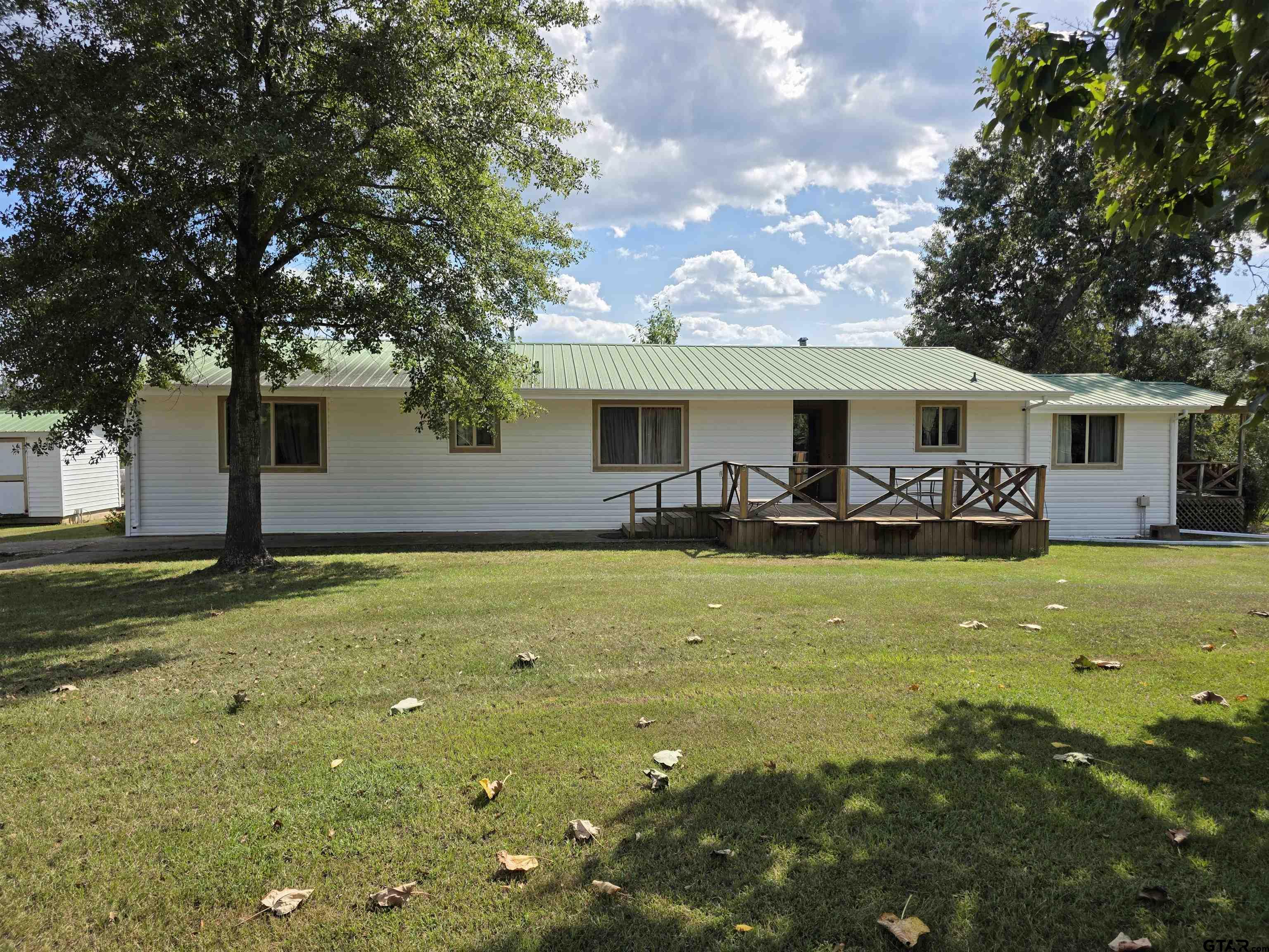 a front view of house with yard and seating area