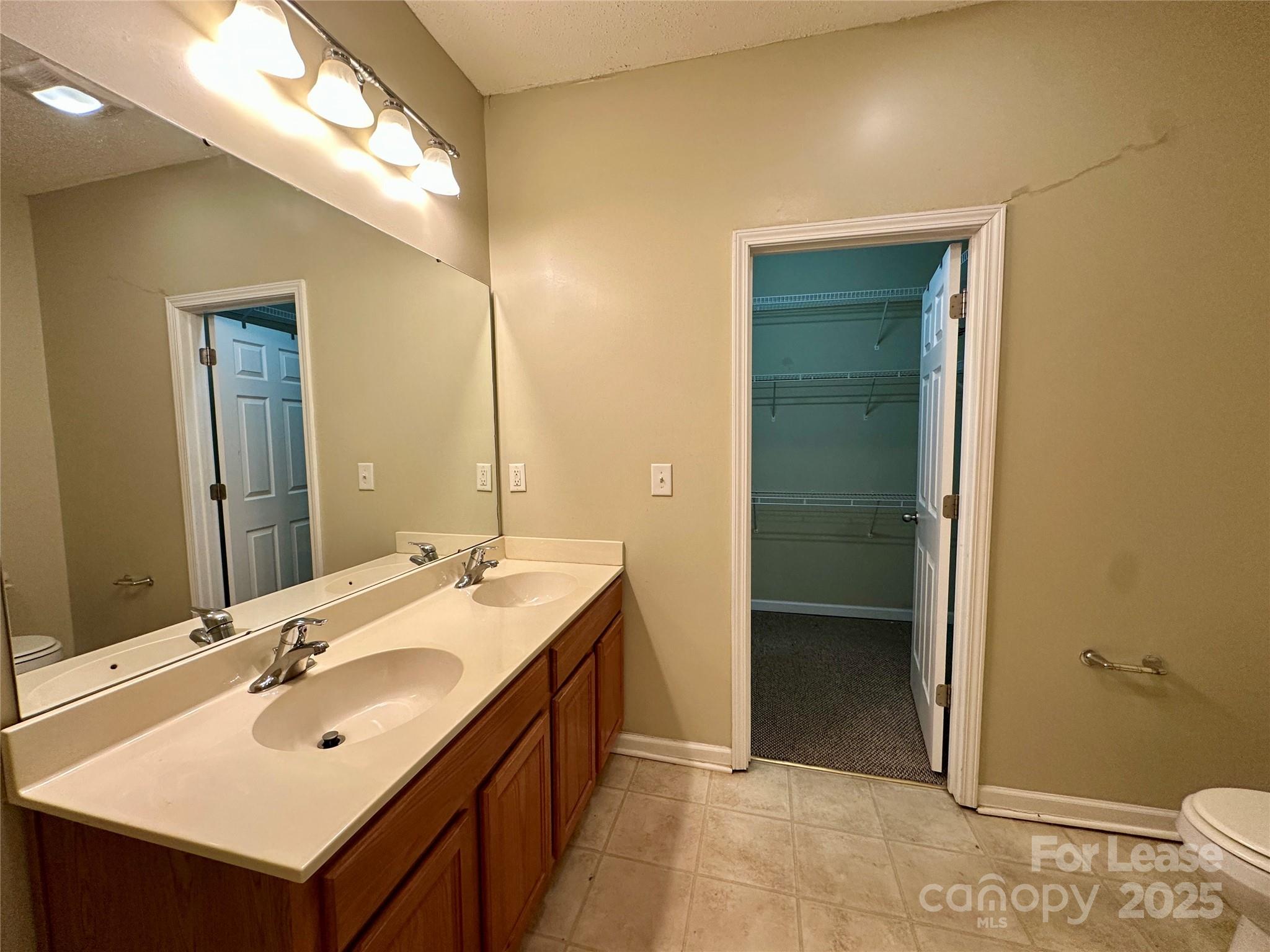 3331 Robinwood Road Gastonia, NC 28054 - Photo 11 of 14 a bathroom with a sink and a mirror