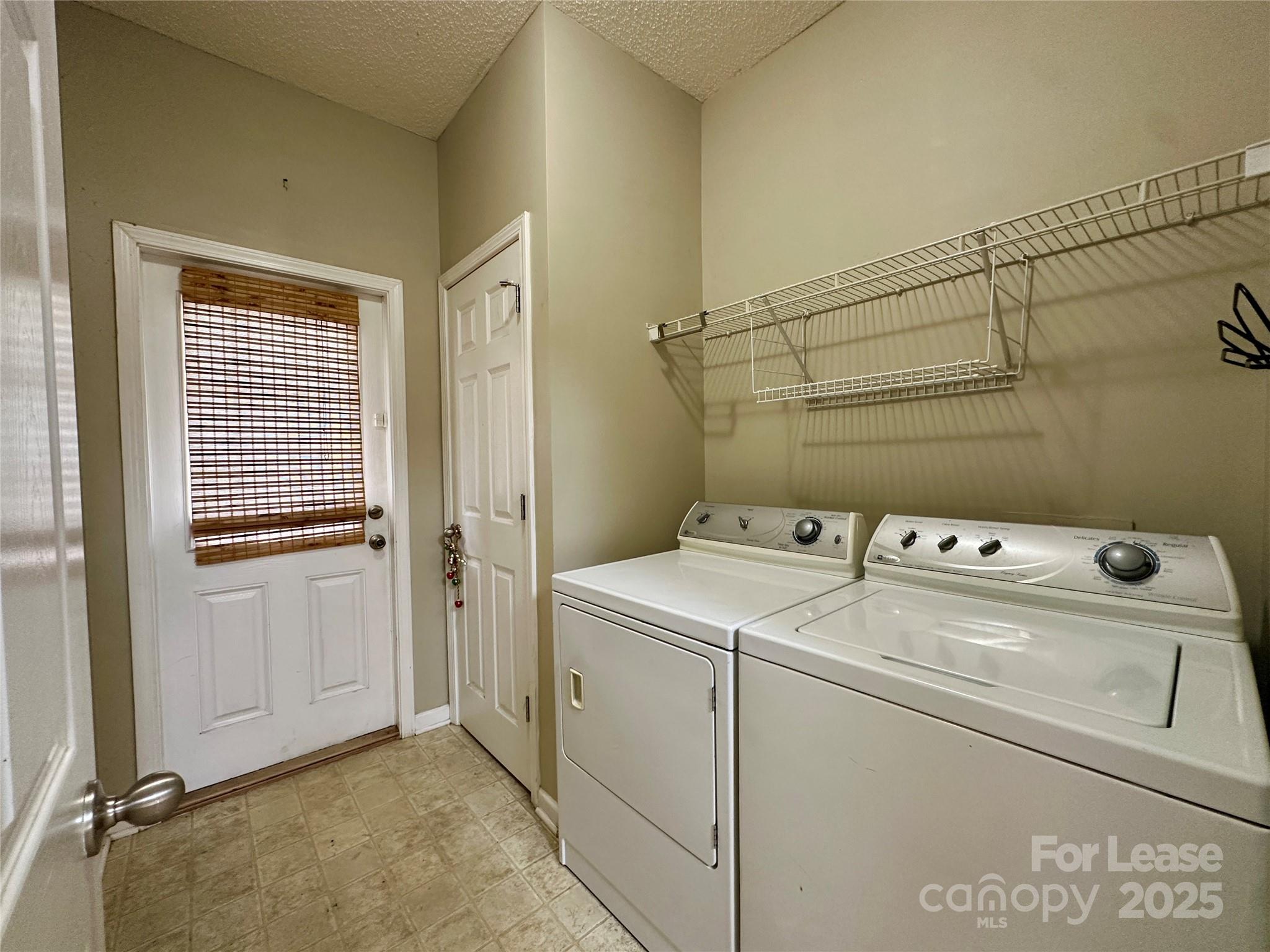 3331 Robinwood Road Gastonia, NC 28054 - Photo 8 of 14 a view of a storage & utility room with dryer and washer