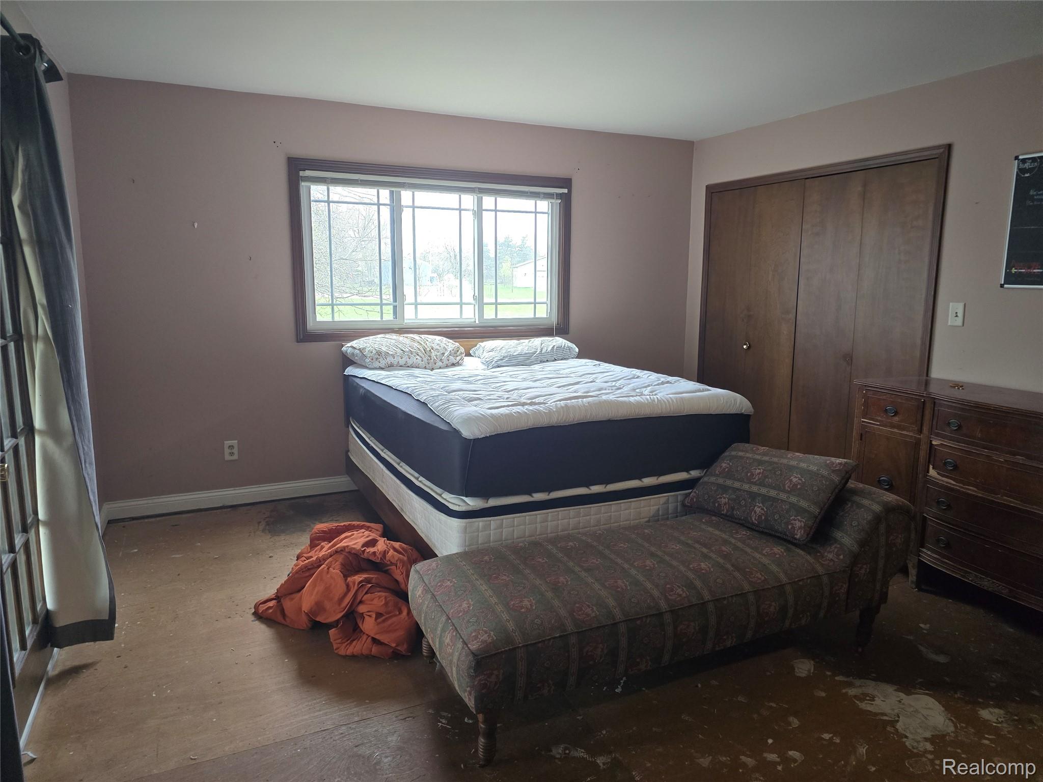 12012 Belle River Road Memphis, MI 48041 - Photo 15 of 41 Bedroom with a closet and dark wood-type flooring