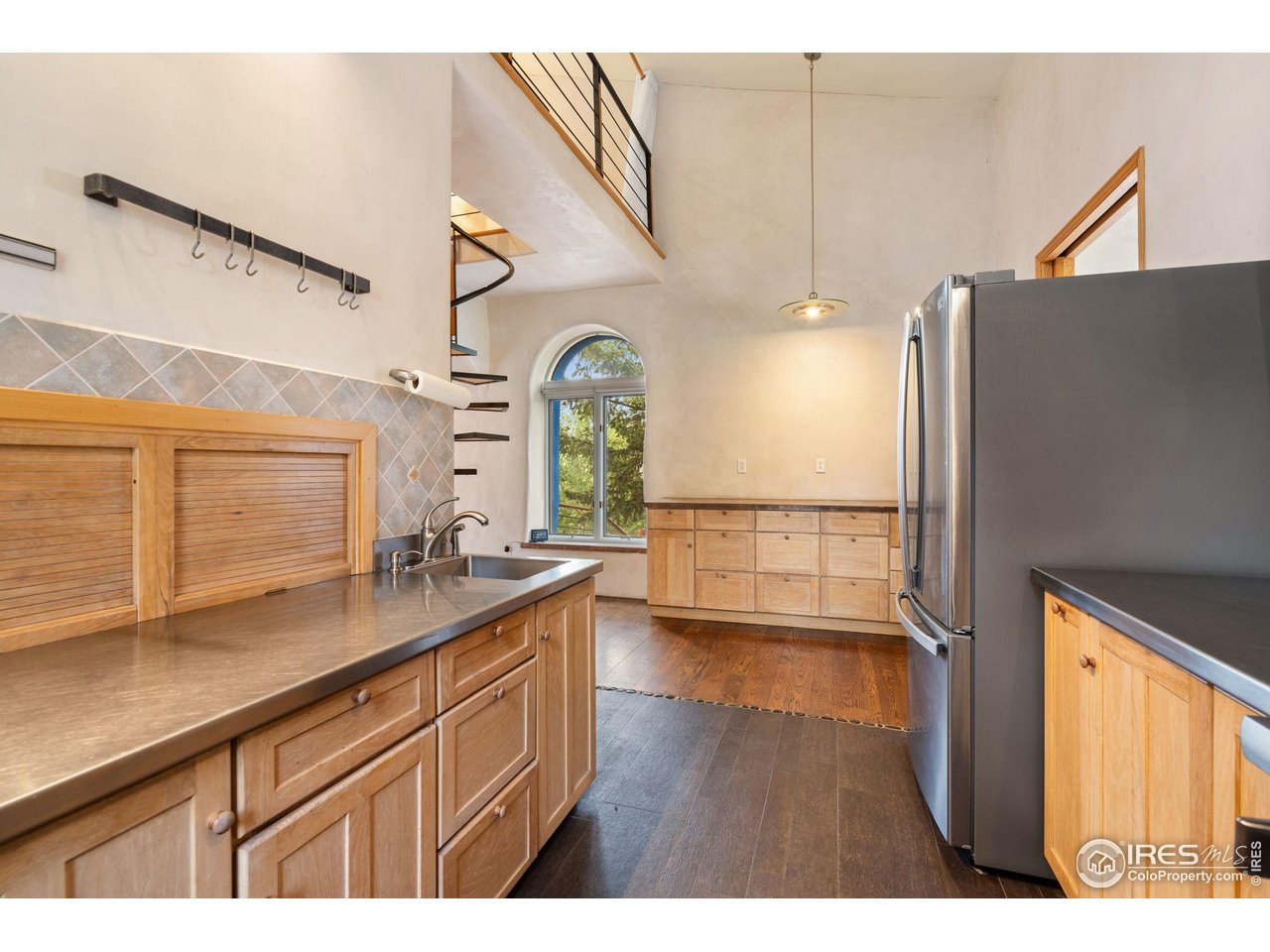 1000 Alaska Road Boulder, CO 80302 - Photo 11 of 50 a view of a kitchen with a sink and wooden floor