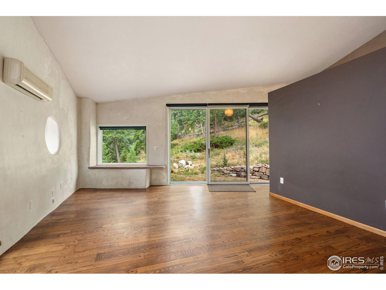 1000 Alaska Road Boulder, CO 80302 - Photo 18 of 50 a view of an empty room with wooden floor and a window