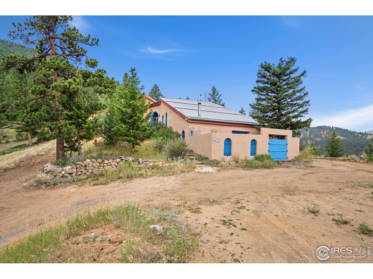 1000 Alaska Road Boulder, CO 80302 - Photo 2 of 50 a front view of a house with a yard