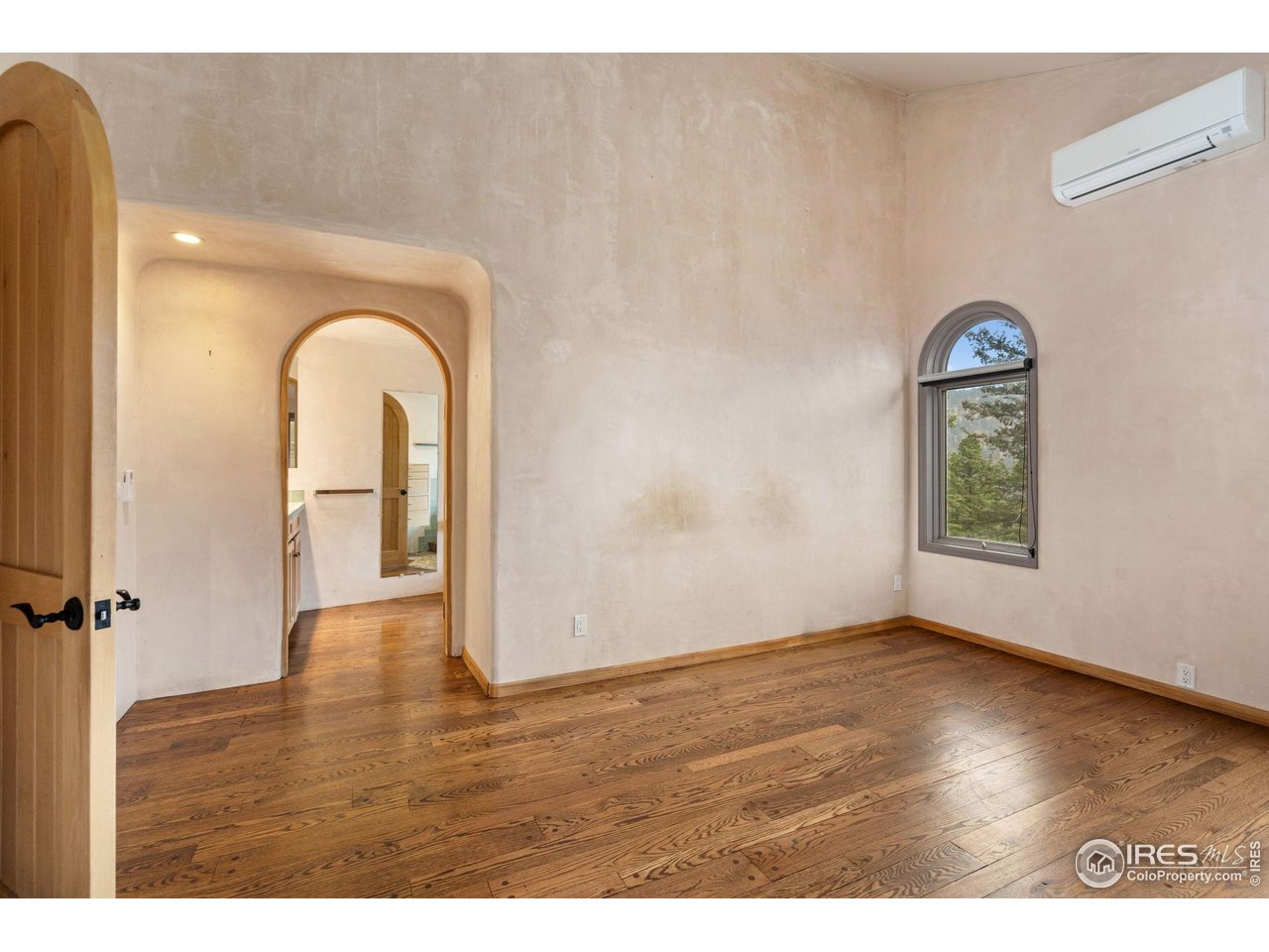 1000 Alaska Road Boulder, CO 80302 - Photo 23 of 50 a view of an empty room with wooden floor and a window