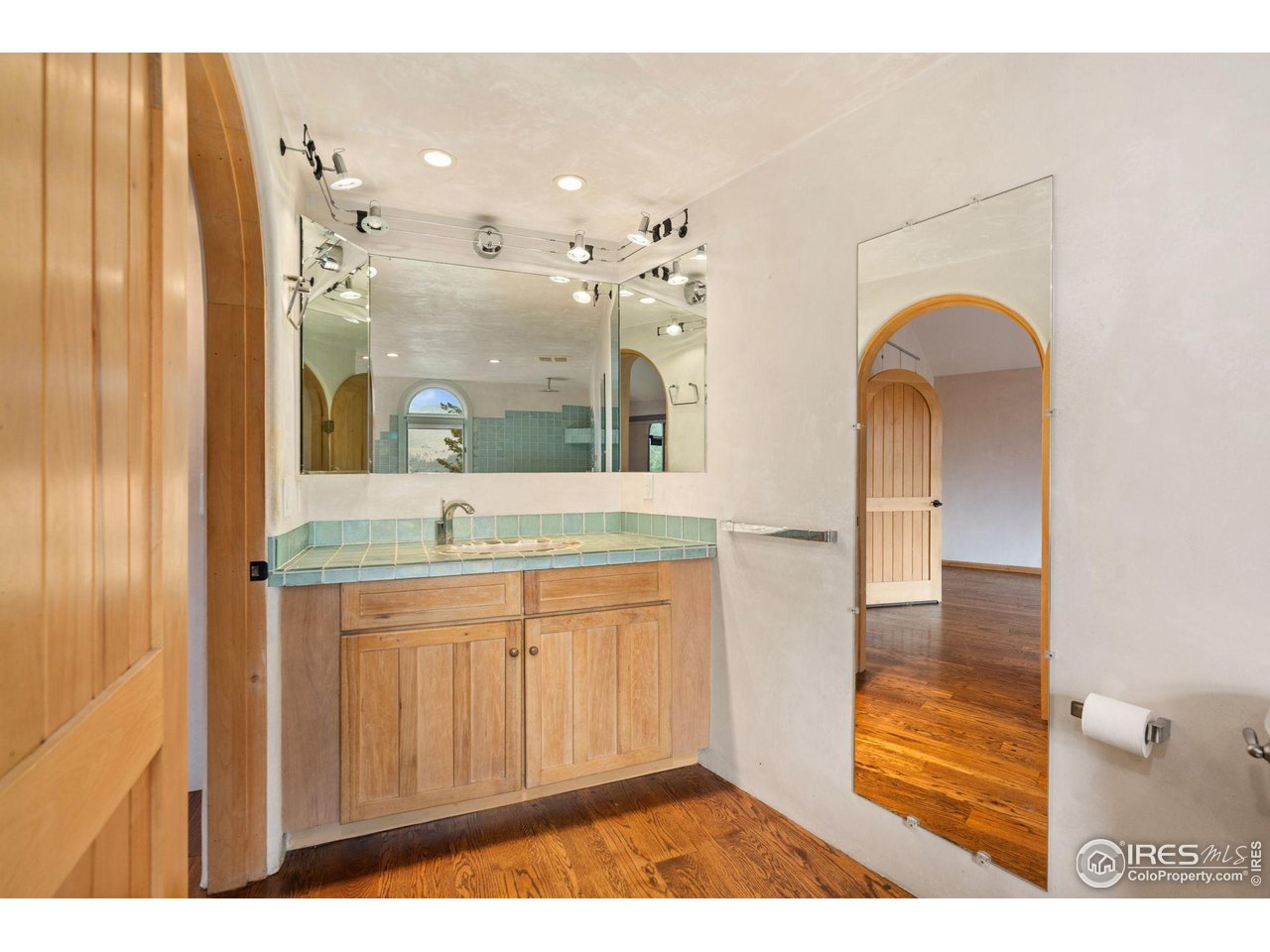 1000 Alaska Road Boulder, CO 80302 - Photo 24 of 50 a bathroom with a sink a mirror and a shower