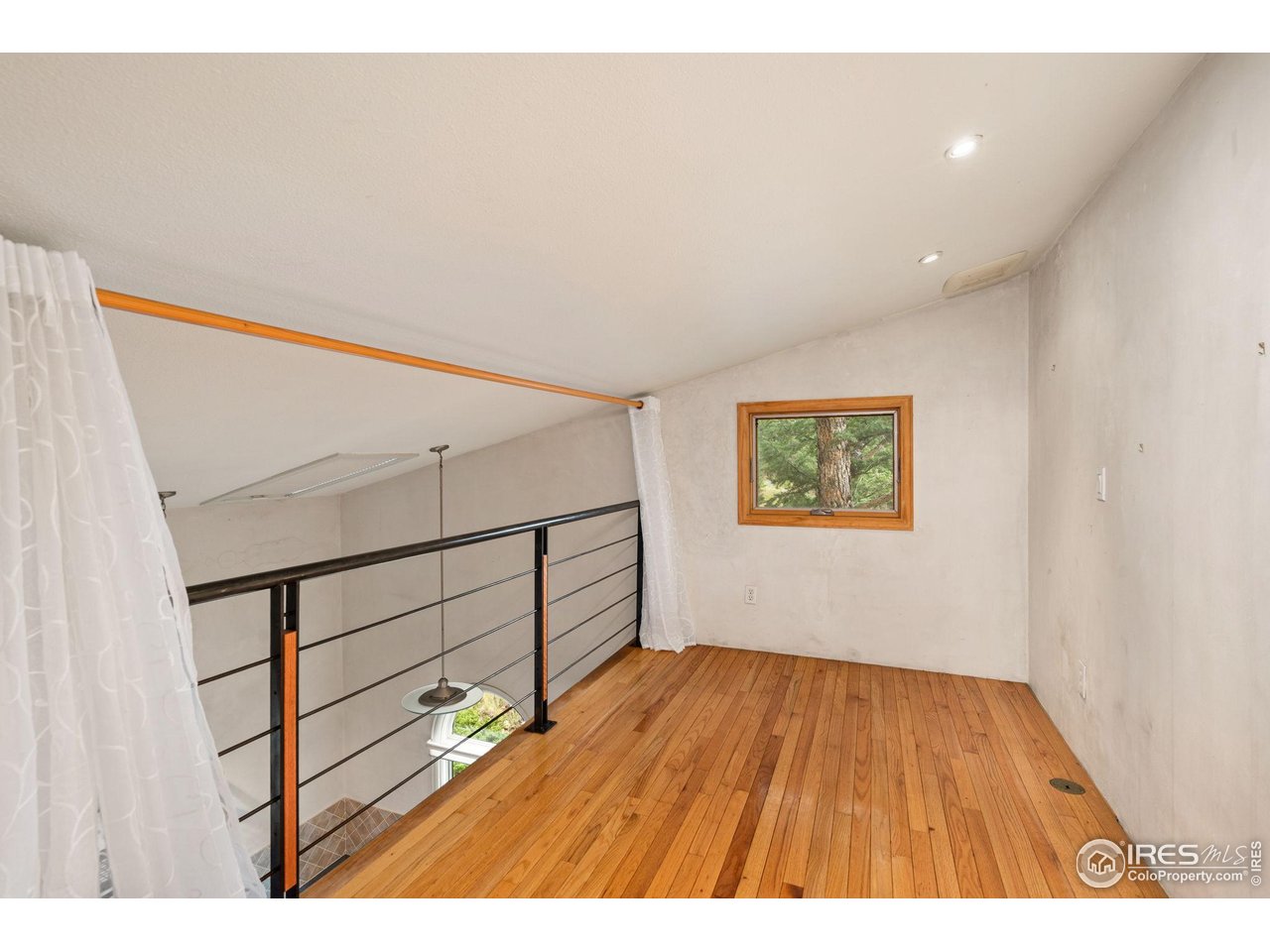 1000 Alaska Road Boulder, CO 80302 - Photo 26 of 50 a view of an empty room with stairs and a window