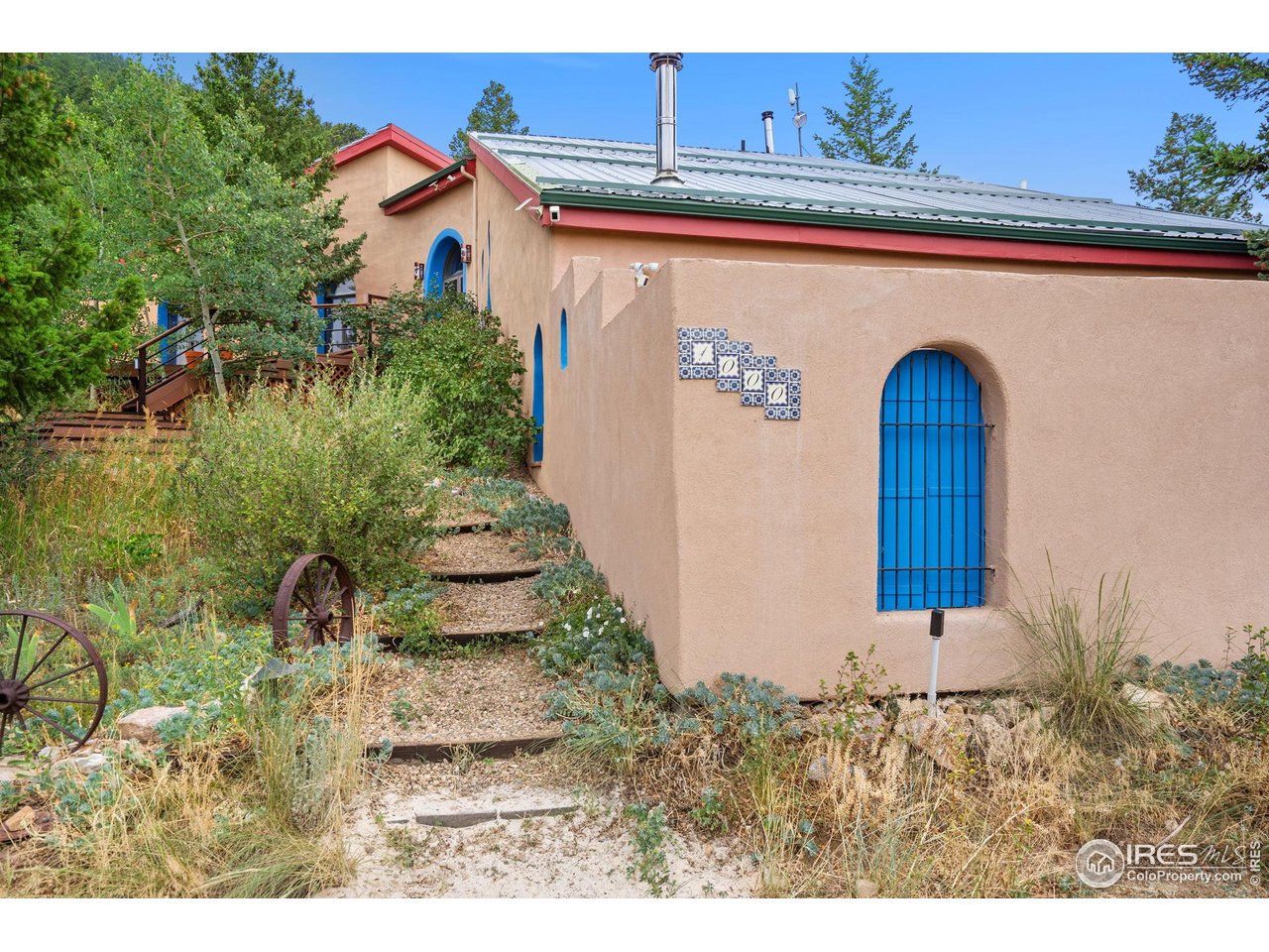 1000 Alaska Road Boulder, CO 80302 - Photo 38 of 50 a front view of a house with a yard