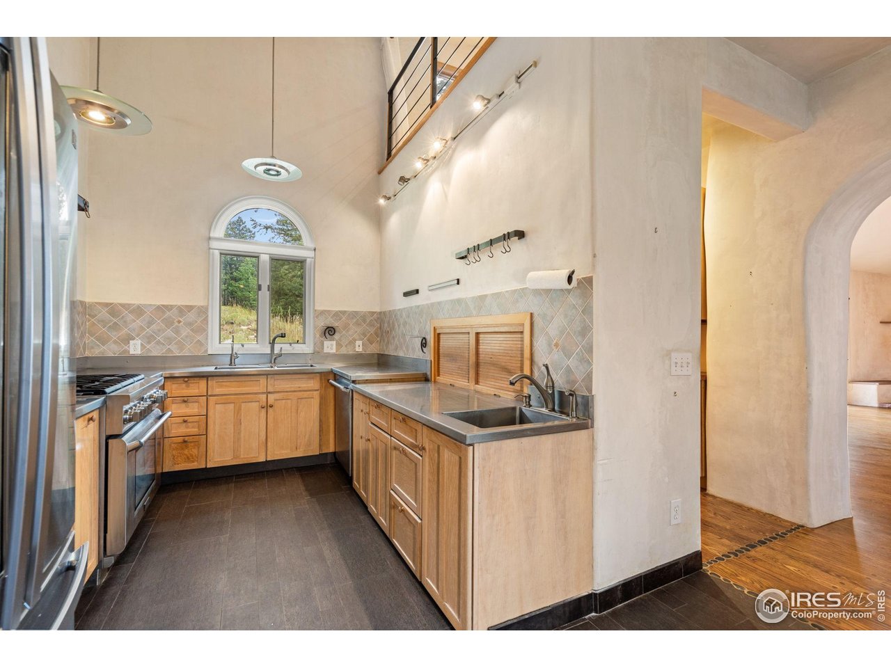 1000 Alaska Road Boulder, CO 80302 - Photo 10 of 50 a kitchen with stainless steel appliances granite countertop a stove a sink and a refrigerator