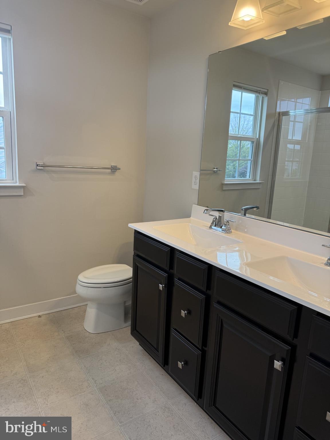 600 Judy Way Newark, DE 19713 - Photo 7 of 14 a bathroom with a sink vanity mirror and toilet