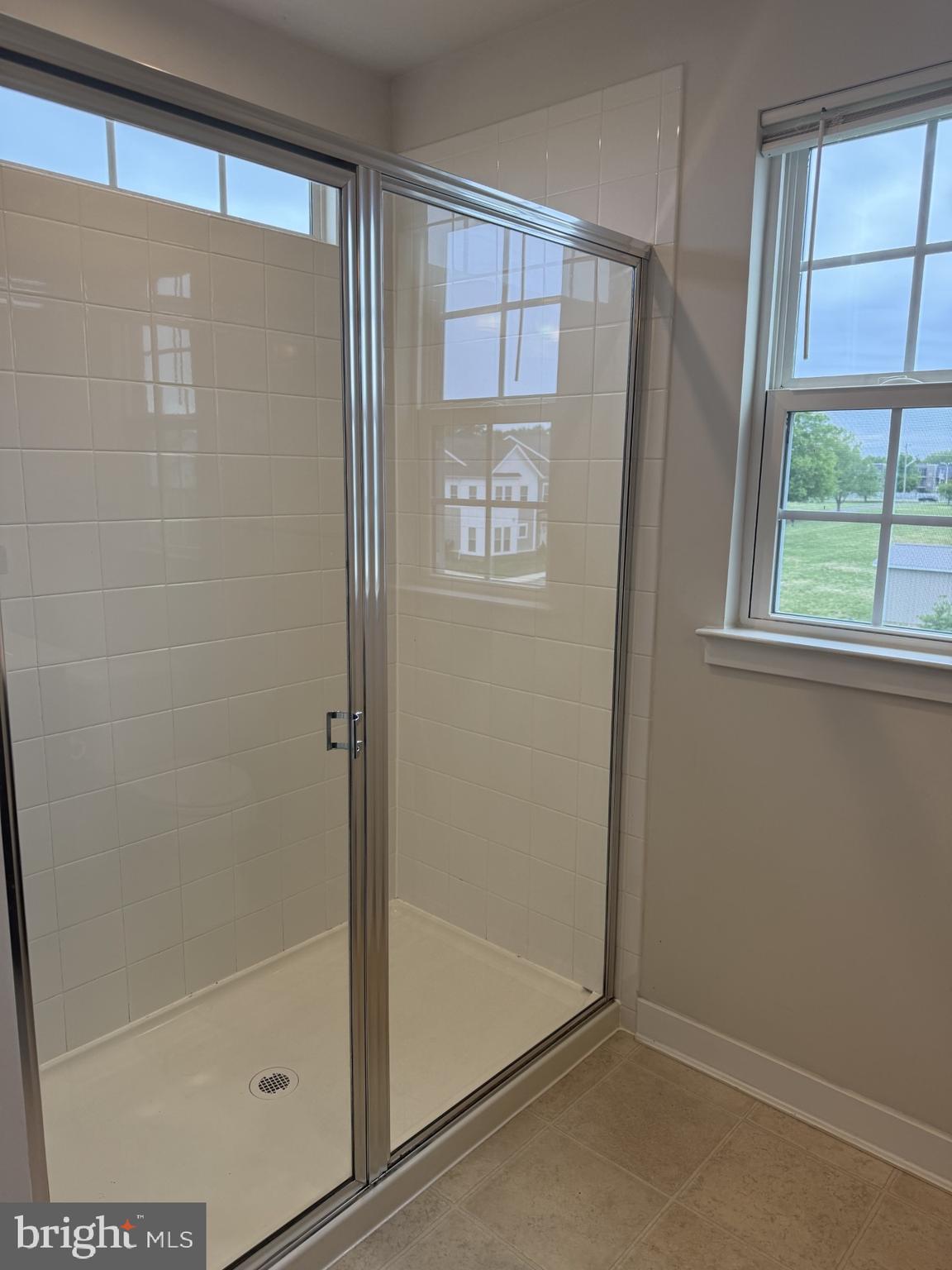 600 Judy Way Newark, DE 19713 - Photo 8 of 14 a bathroom with a glass shower door