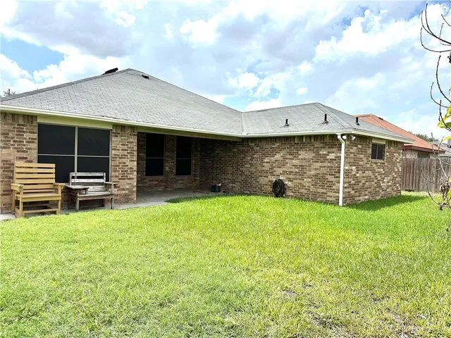 a view of a backyard with sitting area