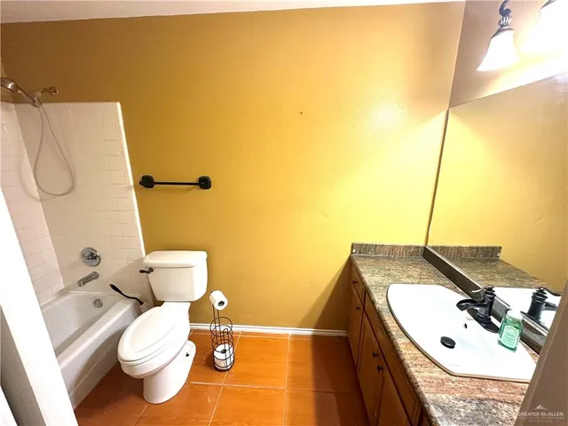 a large bathroom with a large tub and sink