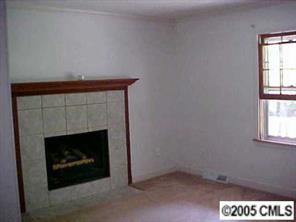 1151 Dunlap Roddey Road Rock Hill, SC 29730 - Photo 7 of 8 a hallway with a fireplace