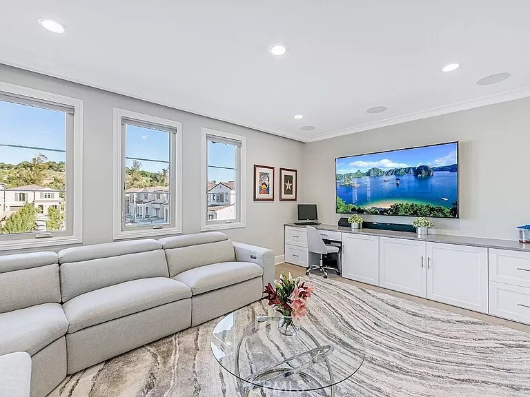 65 Rockinghorse Irvine, CA 92602 - Photo 21 of 45 a living room with furniture and a flat screen tv