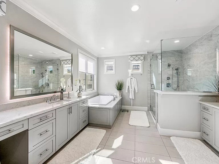 65 Rockinghorse Irvine, CA 92602 - Photo 26 of 45 a spacious bathroom with a bathtub shower sink mirror and toilet