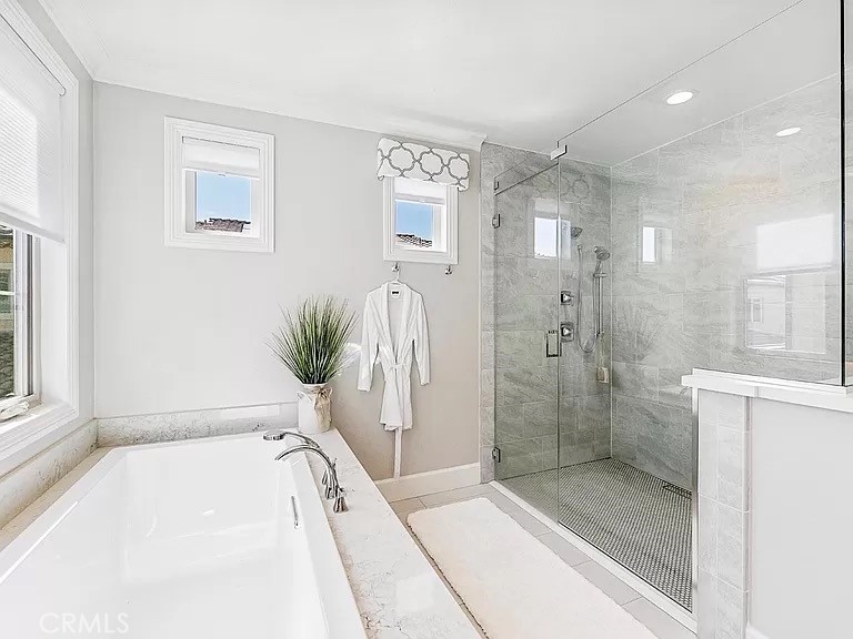 65 Rockinghorse Irvine, CA 92602 - Photo 27 of 45 a bathroom with a tub shower and sink