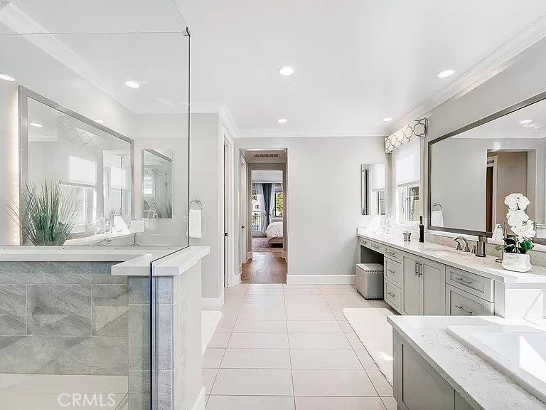 65 Rockinghorse Irvine, CA 92602 - Photo 28 of 45 a large white kitchen with a large window