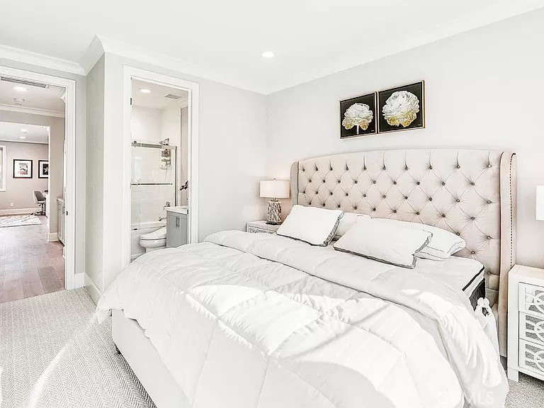 65 Rockinghorse Irvine, CA 92602 - Photo 29 of 45 a bedroom with a bed and a painting on the wall