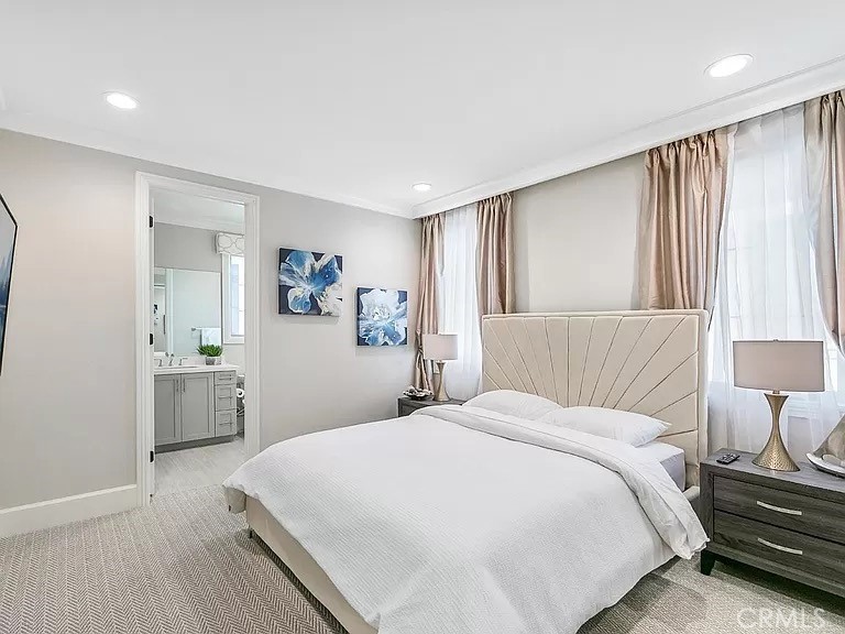 65 Rockinghorse Irvine, CA 92602 - Photo 31 of 45 a bedroom with a large bed and a wooden floor