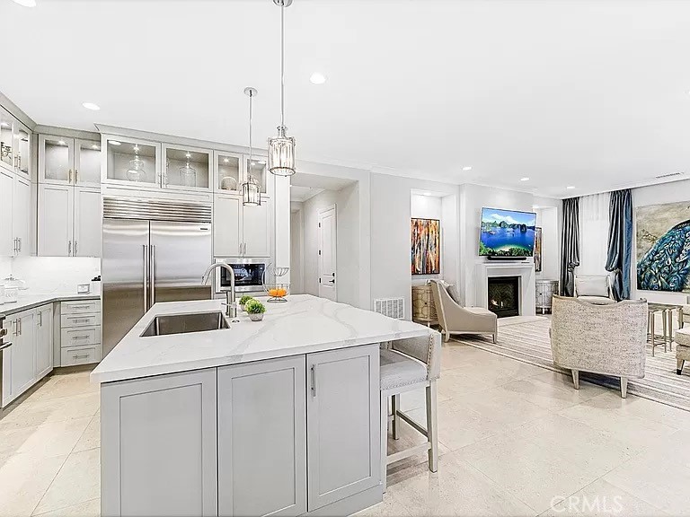 65 Rockinghorse Irvine, CA 92602 - Photo 6 of 45 a kitchen that has a lot of cabinets a sink and wooden floor
