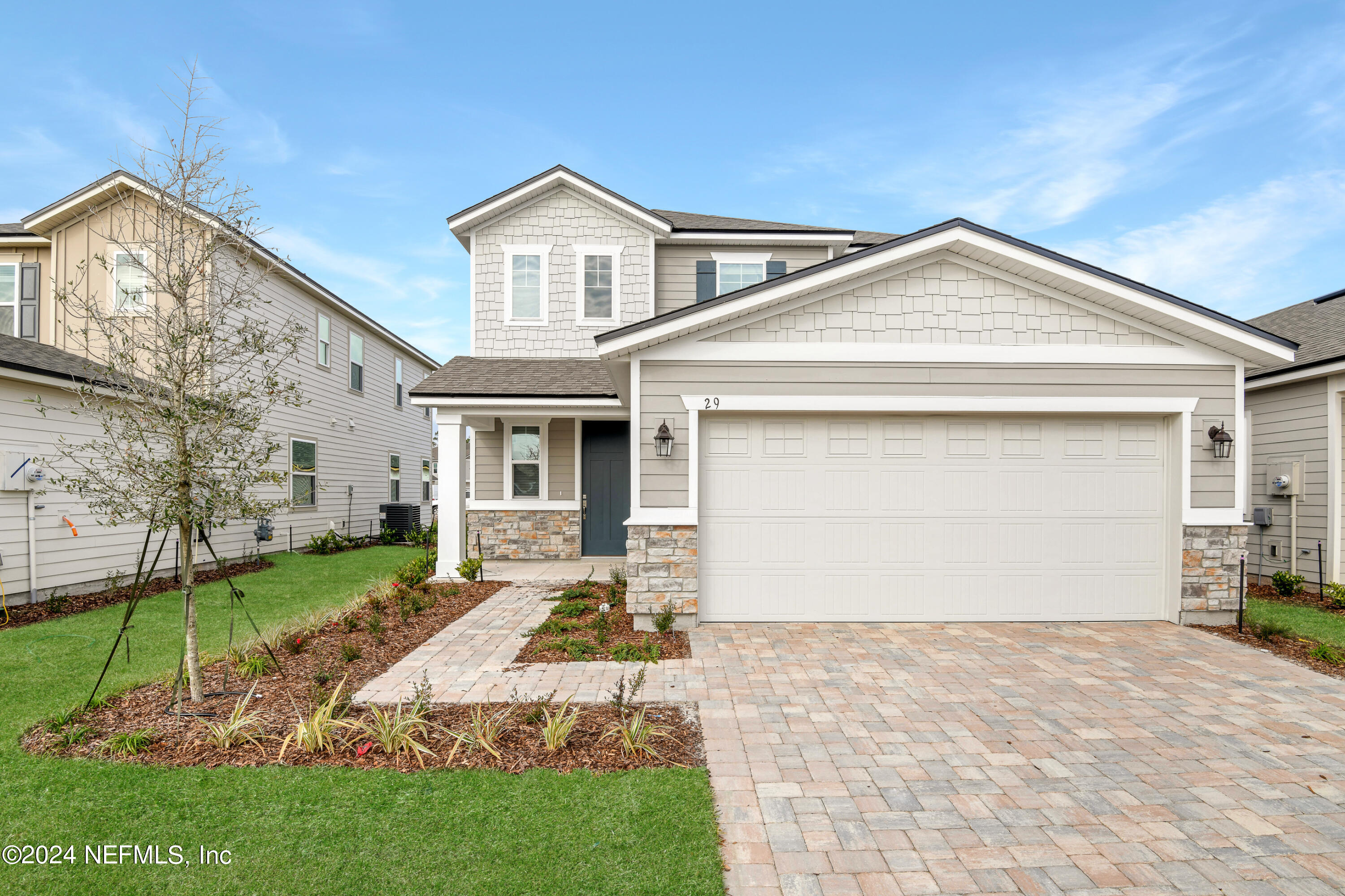 29 Cedar Elm Way St. Augustine, FL 32092 - Photo 1 of 28 a front view of a house with a yard and garage