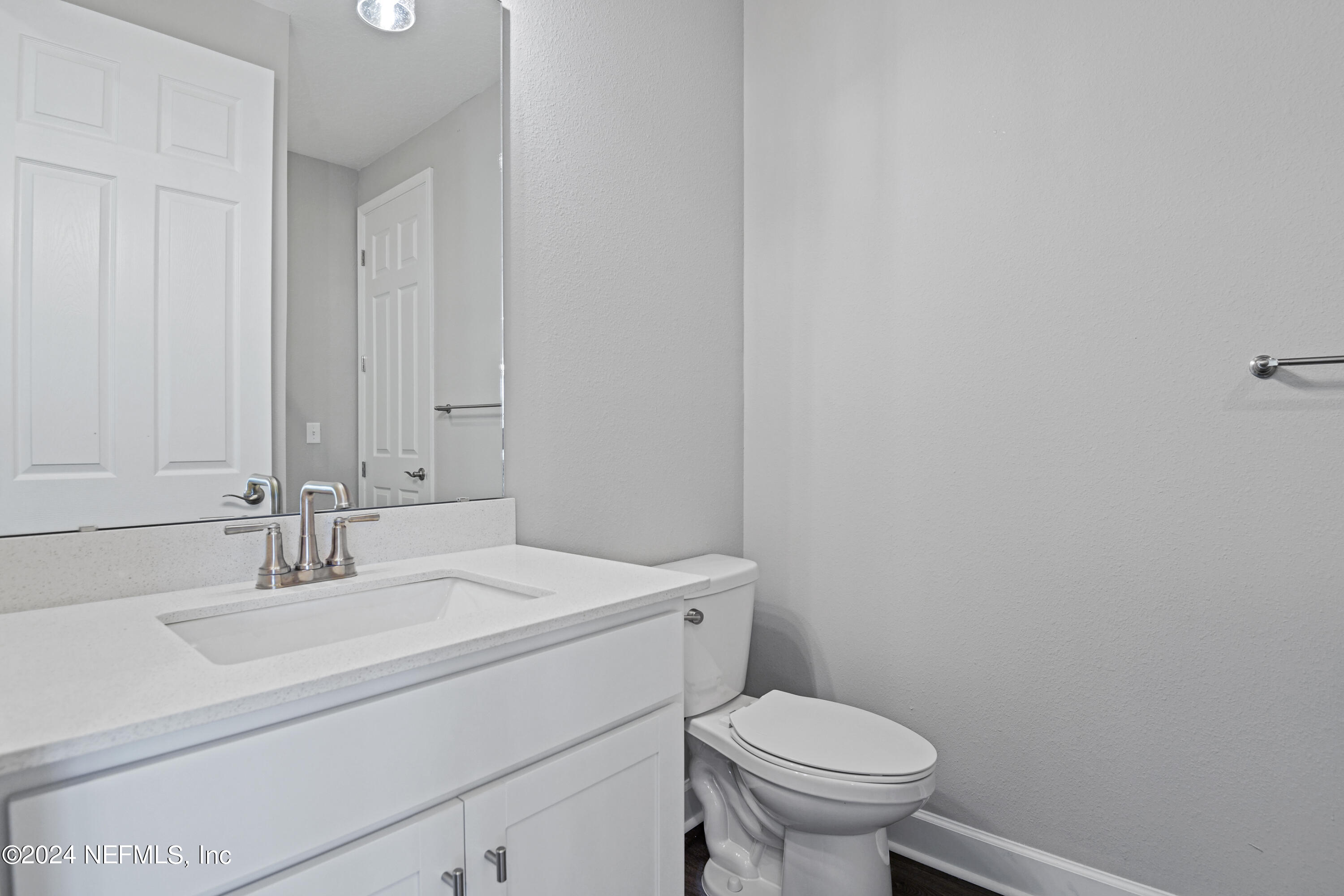 29 Cedar Elm Way St. Augustine, FL 32092 - Photo 11 of 28 a bathroom with a sink a toilet and a mirror