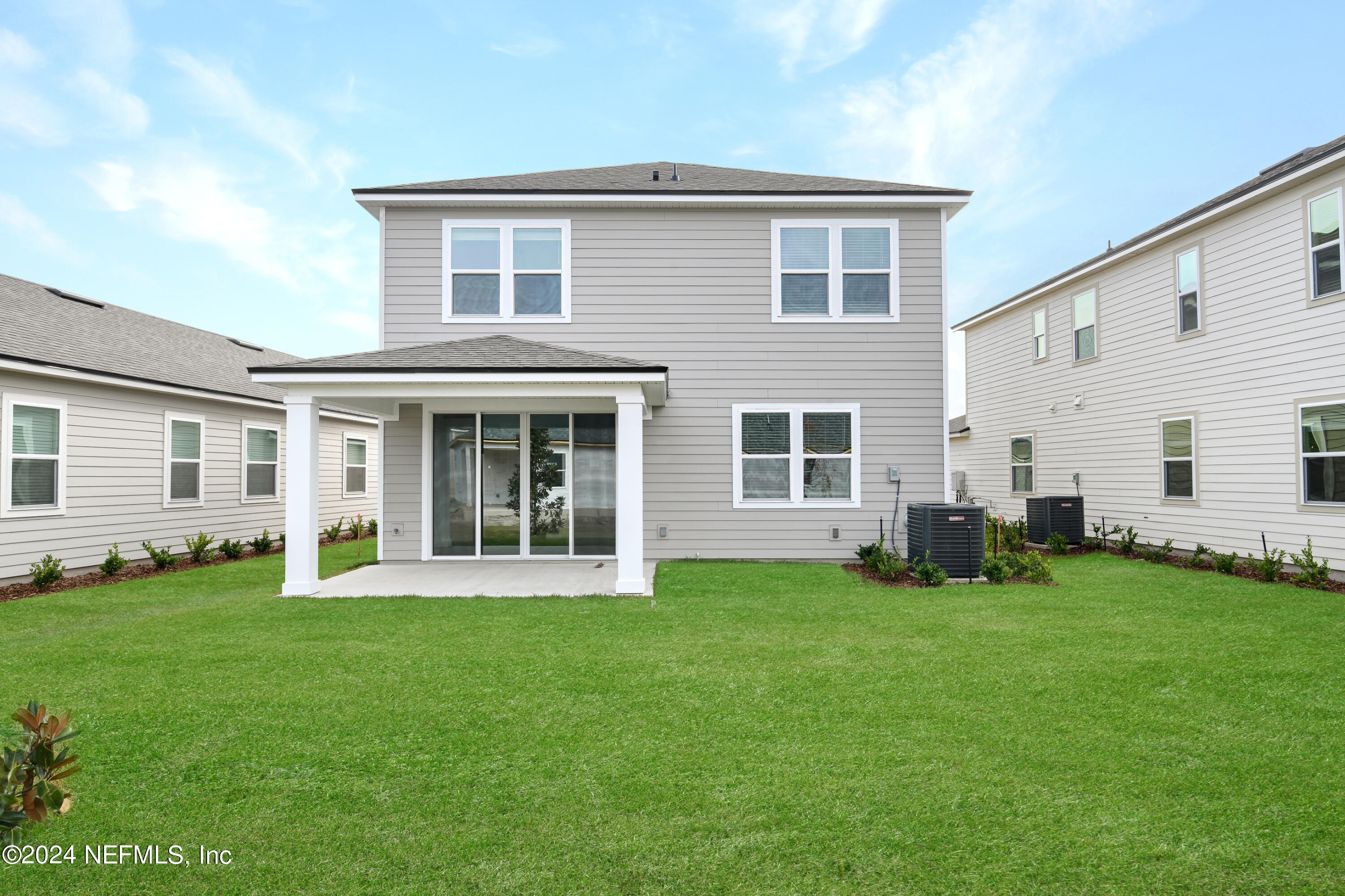 29 Cedar Elm Way St. Augustine, FL 32092 - Photo 18 of 28 a front view of a house with a yard
