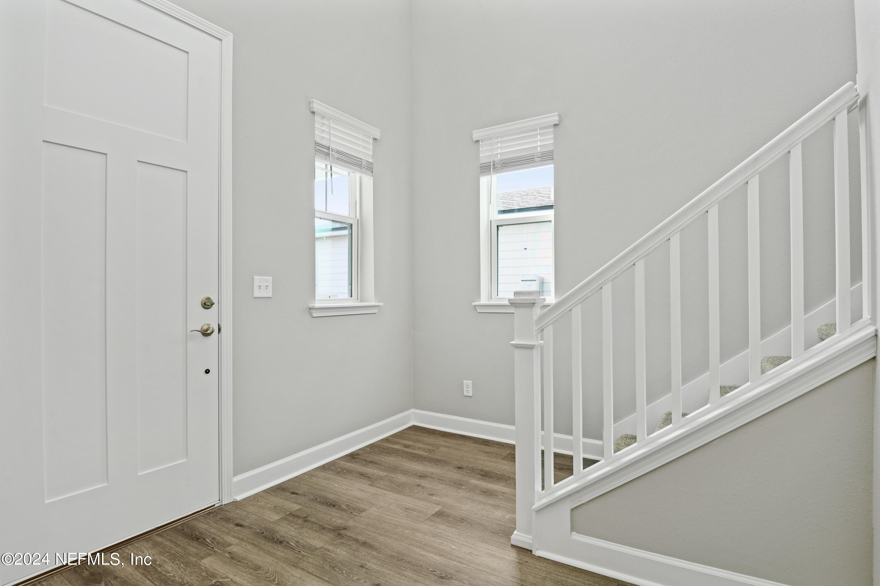 29 Cedar Elm Way St. Augustine, FL 32092 - Photo 9 of 28 a view of a hallway with wooden floor and entryway