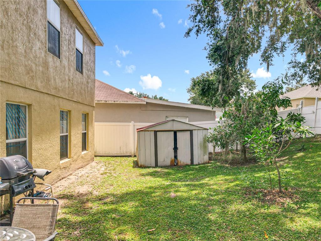 7939 Riffle Lane Orlando, FL 32818 - Photo 42 of 52 a view of a house with backyard