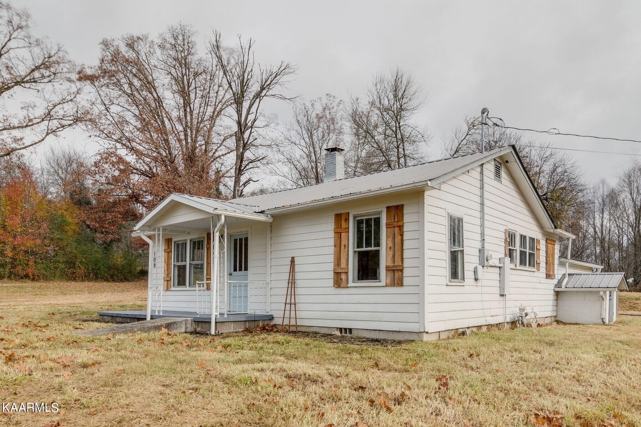 108 Davidson Street Deer Lodge, TN 37726 - Photo 29 of 30 a view of a house with a yard