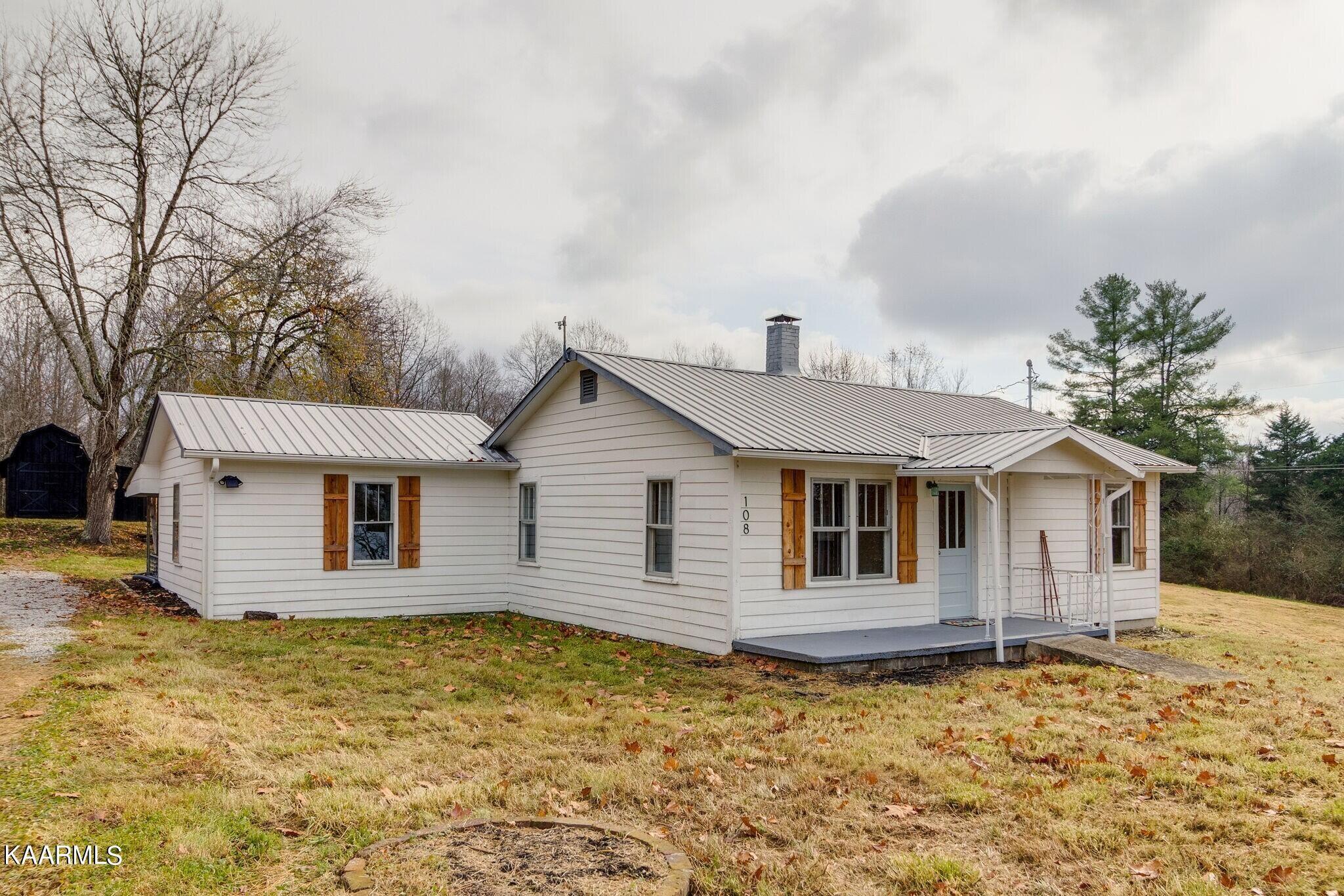 108 Davidson Street Deer Lodge, TN 37726 - Photo 30 of 30 a view of a house with a yard