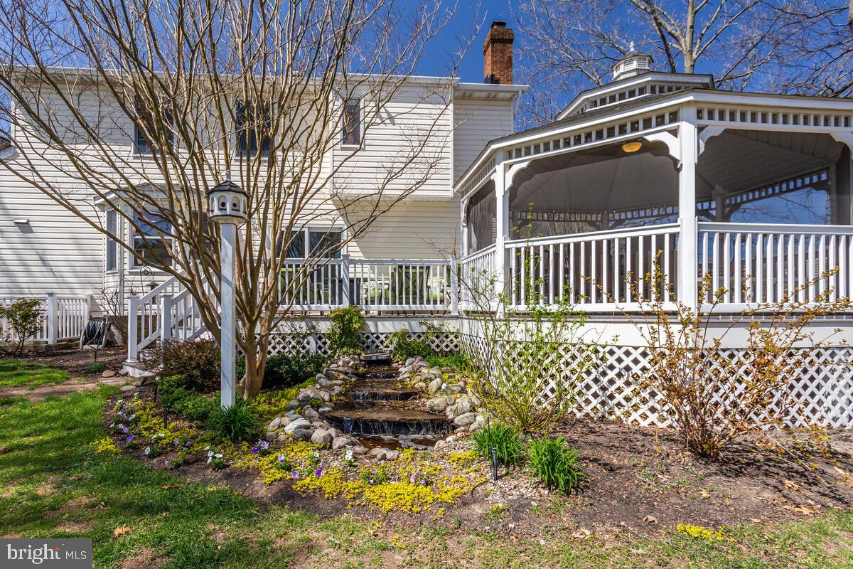 7883 Poplar Grove Road Severn, MD 21144 - Photo 58 of 77 a front view of a house with a yard