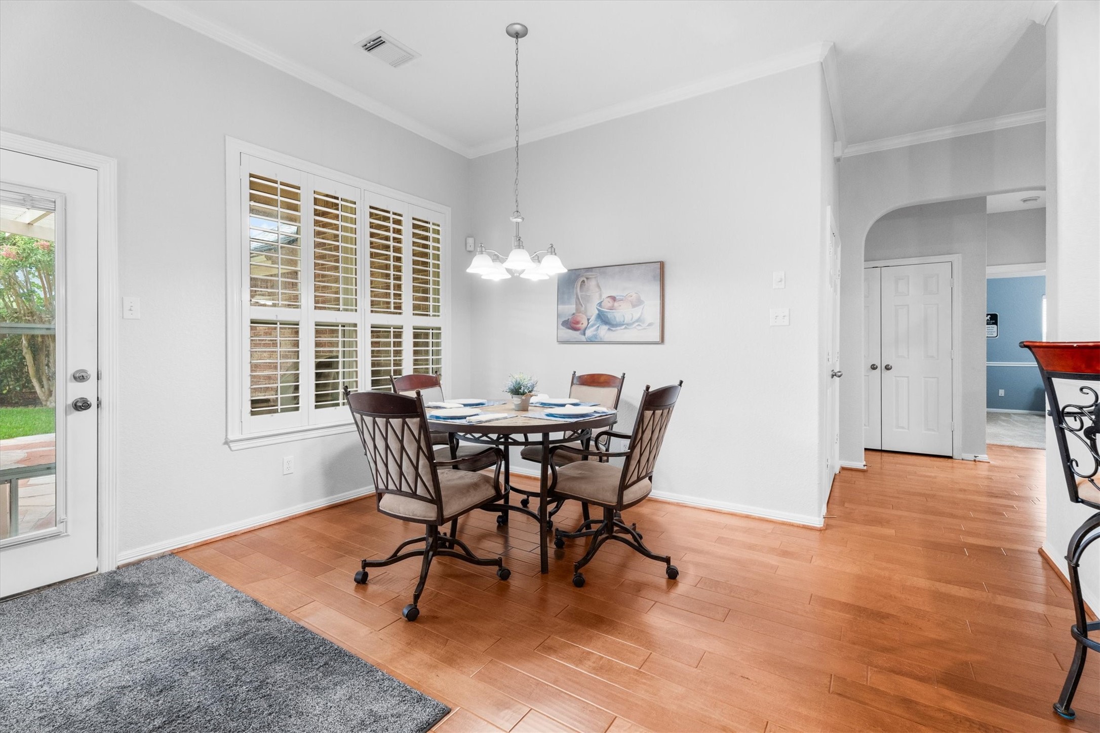 9406 Lochflora Drive Spring, TX 77379 - Photo 21 of 49 a view of a dining room with furniture and wooden floor