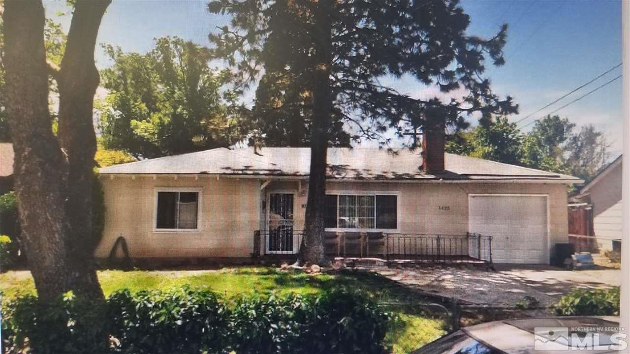 1425 Princess Avenue Reno, NV 89502 - Photo 1 of 4 a front view of a house with a yard