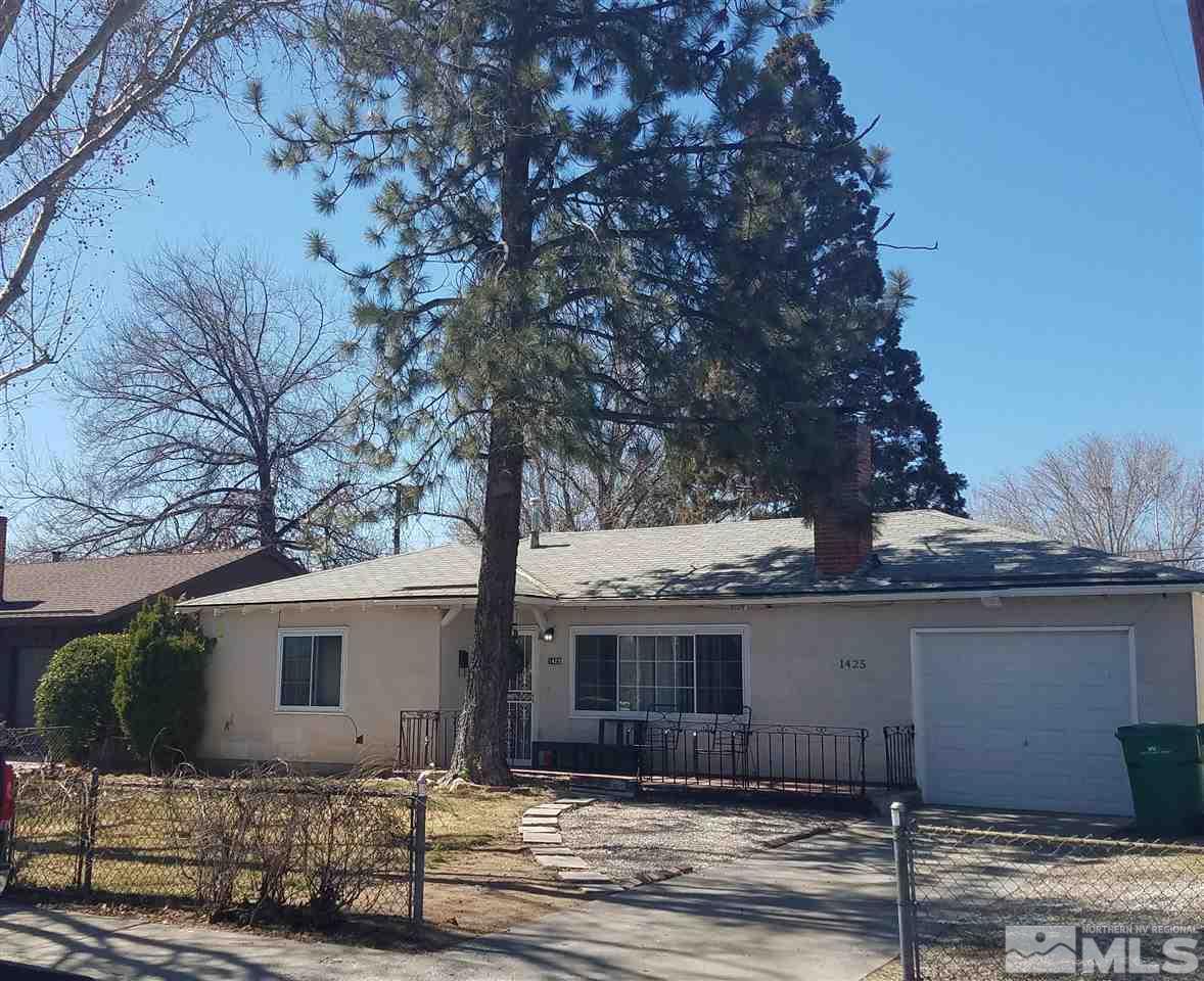 1425 Princess Avenue Reno, NV 89502 - Photo 3 of 4 a tree in front of a white house