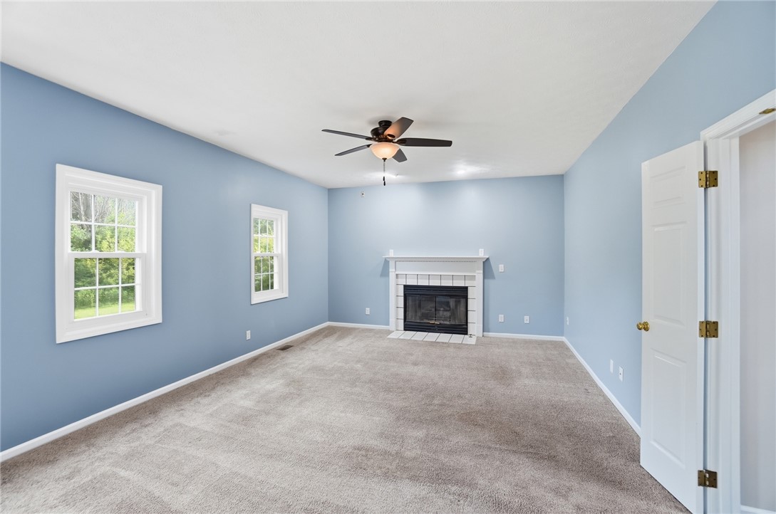 10 Chase Court Springboro, OH 45066 - Photo 12 of 75 This airy living space offers comfortable carpeting and a classic fireplace.
