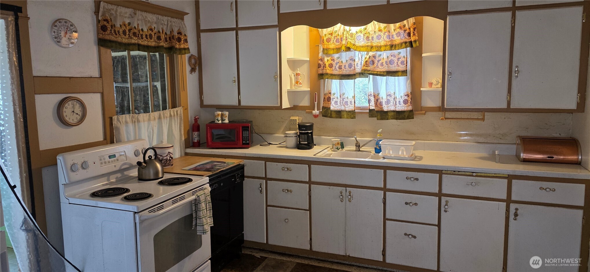 15841 Highway 2 Waterville, WA 98858 - Photo 13 of 40 a kitchen with cabinets and window