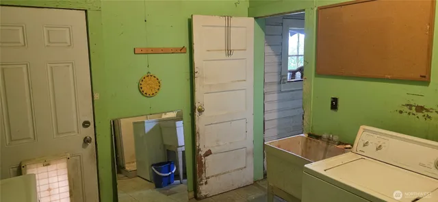 a kitchen with sink cabinets and window