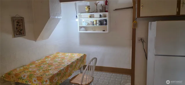 a bathroom with a bathtub sink vanity and mirror