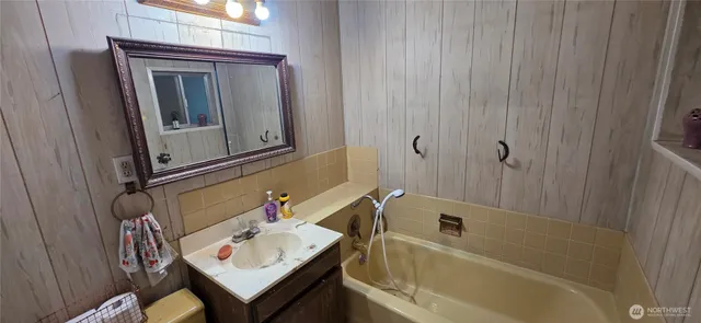 a room that has a bed and a chair in it