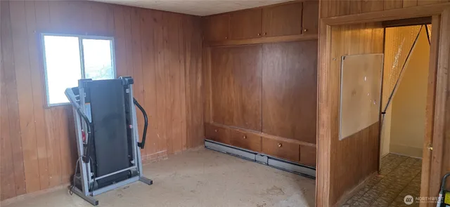 a view of a storage and utility room with windows