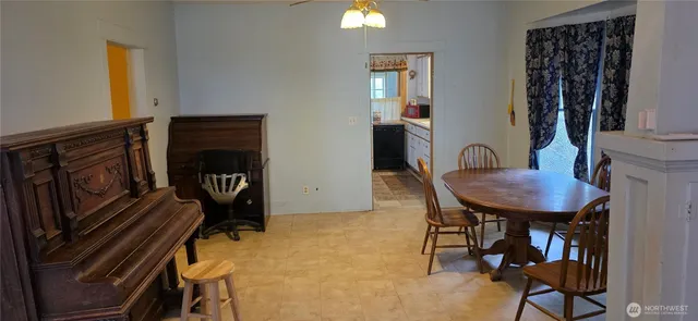 a view of a door and wooden floor